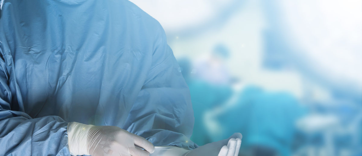 Medical team preparing equipment for surgery in operation room